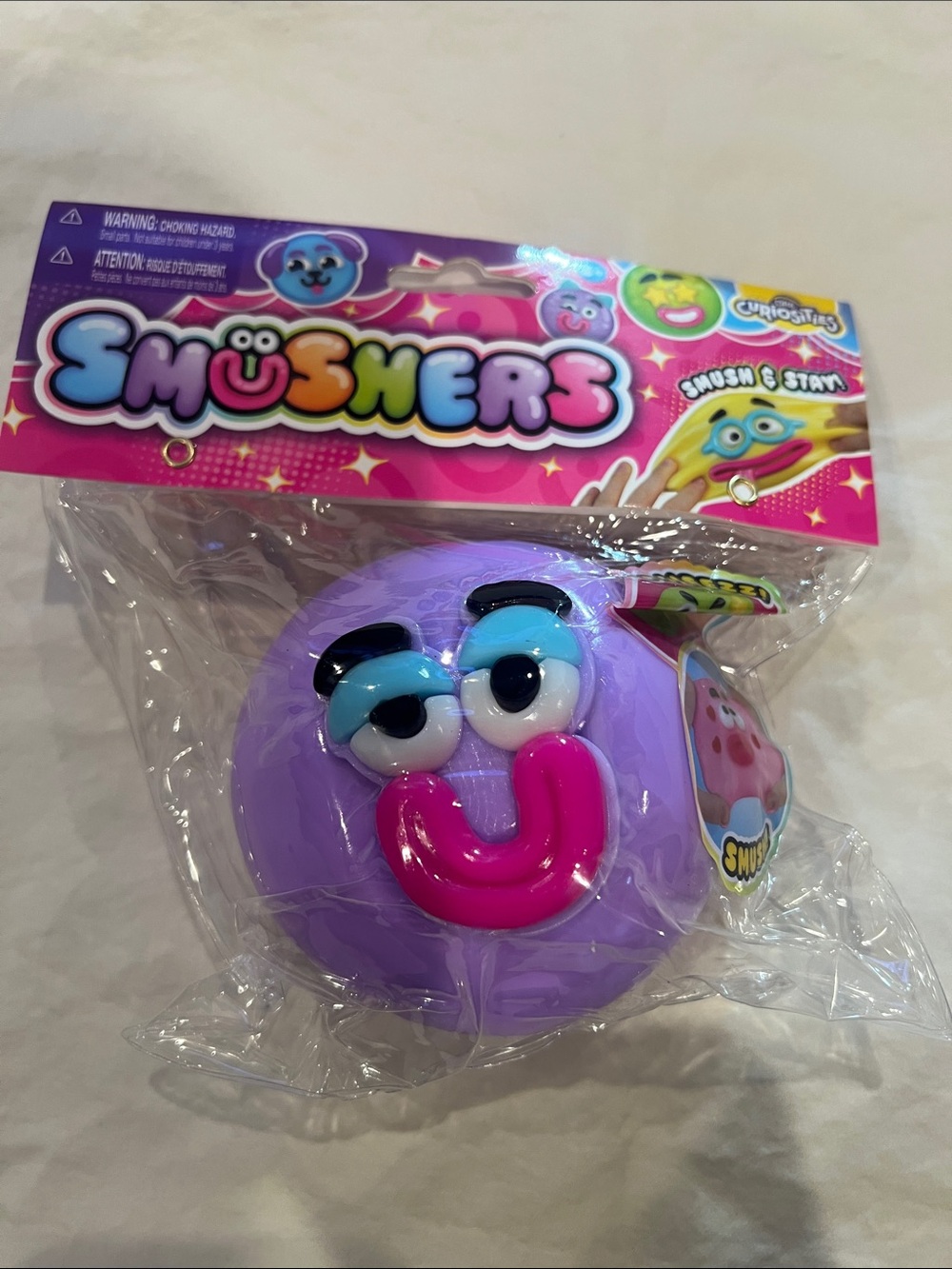 Smushers  Purple Squishy Face Toy with Bright Pink Smile